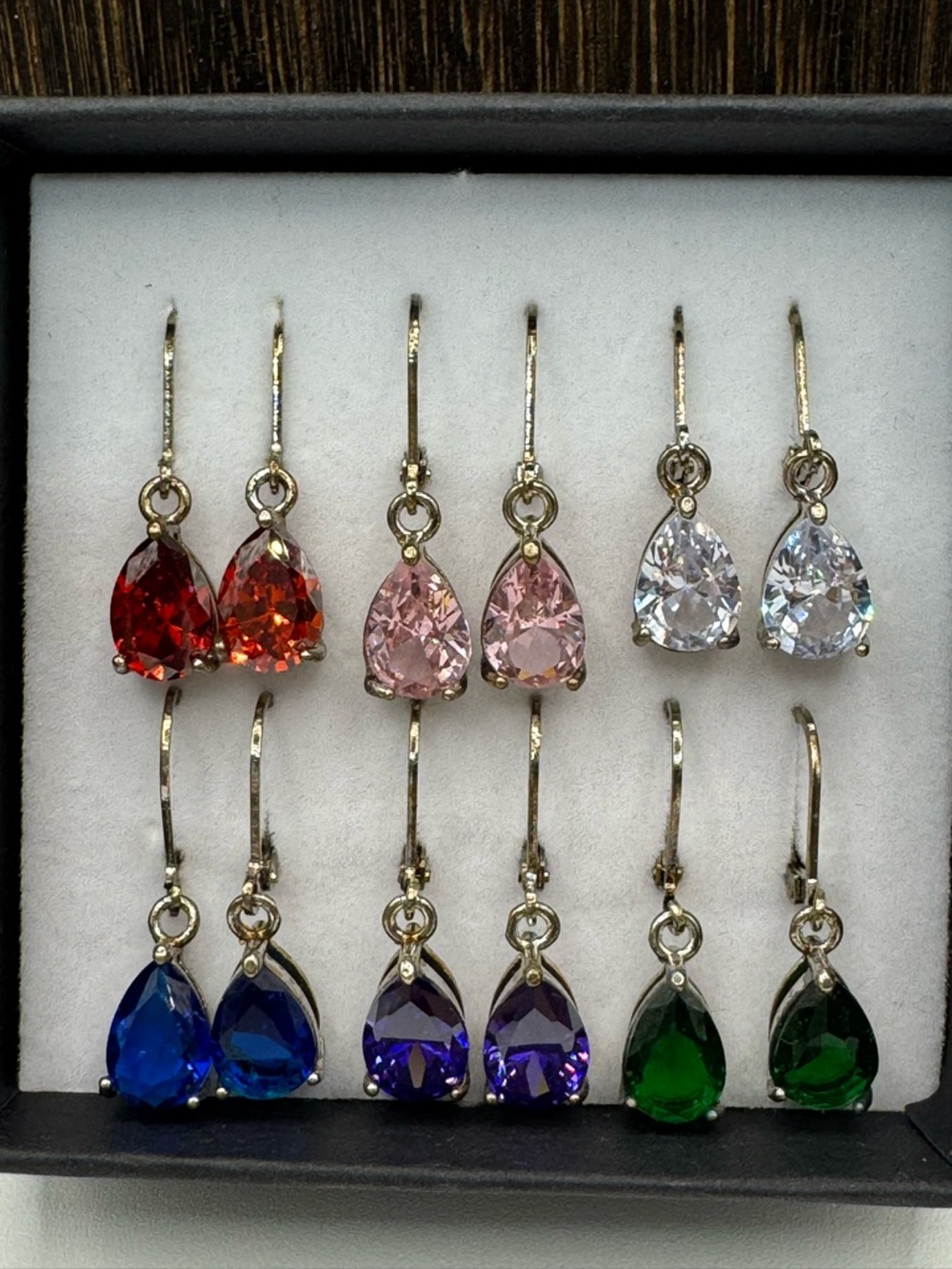 The skyline collection 6 pair set teardrop  CZ antique-gold toned earrings.